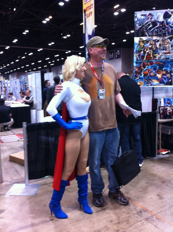 power Girl poses with pal. 