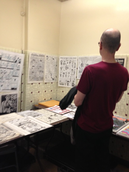 Charles Burns admiring the Scott Eder Gallery table