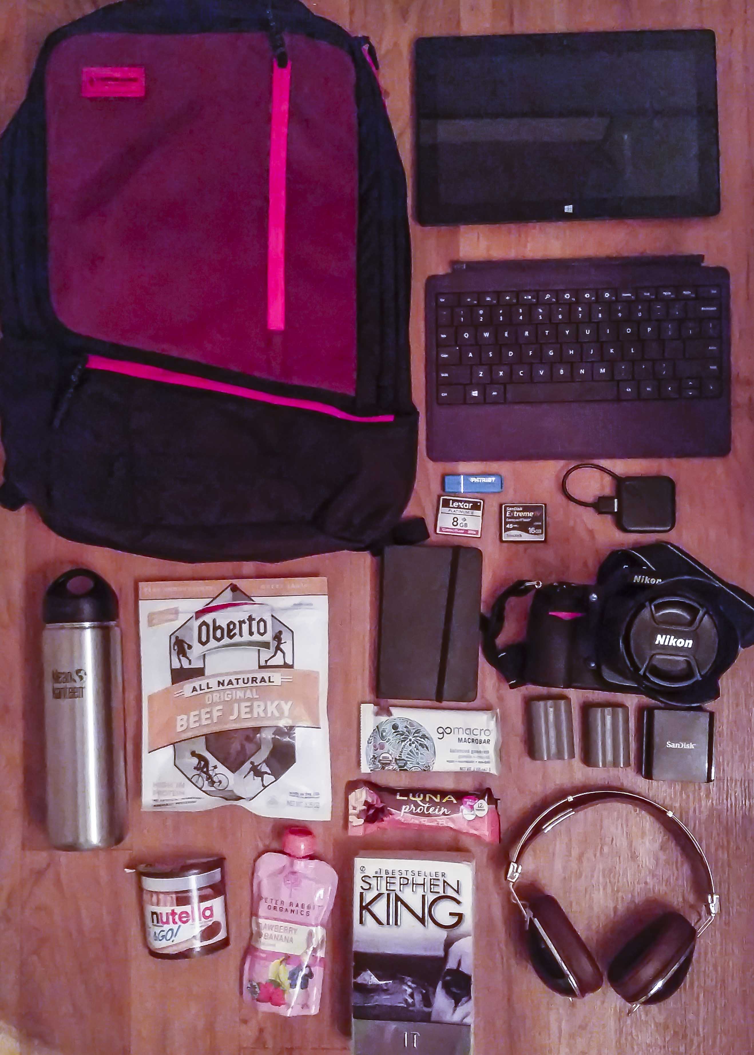 My Pack: Timbuk2 bag, Surface Pro 1 tablet, keyboard, 128GB Patriot USB drive, Nikon camera with lens, Skullcandy headset, Mole skin notebook, food, aluminum drink container.