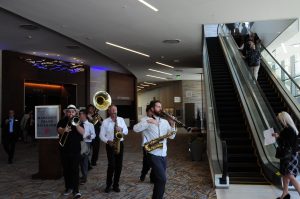 Band Plays the guests and press into the new building.