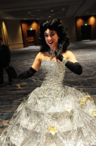 In Comic-Con fashion, this cosplayer features a dress that holds glasses of champagne for guests to take.