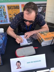 Max signing books at NCS Fest