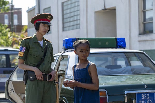 Angela receives a gift from a Saigon police officer on Watchmen