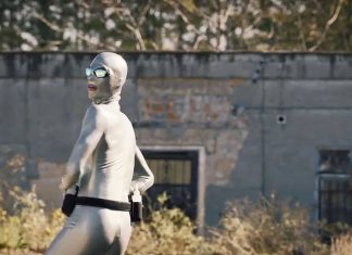 WATCHMEN’s Lube Man reveals his secret identity following epic rap with Trent Reznor & Atticus Ross