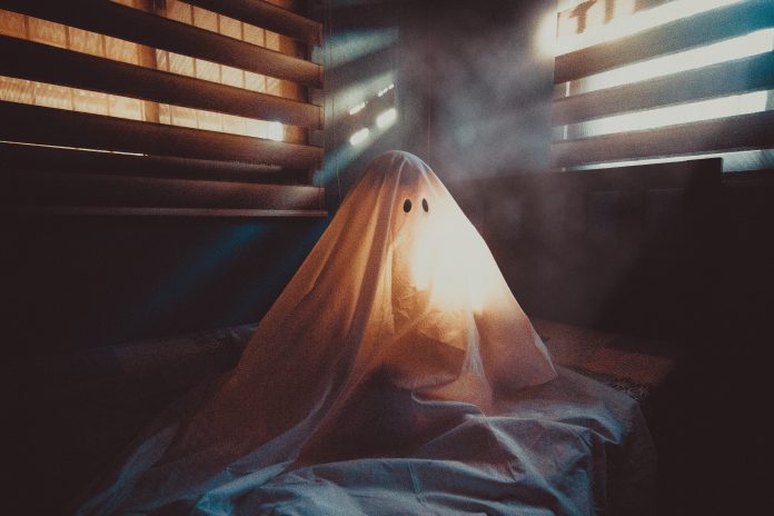 A spooky ghost all alone on Halloween