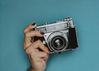 FANDOM FLAMES: Back in time with nostalgic fandom Nostalgic fandom bursts forth much like this hand holding a vintage camera