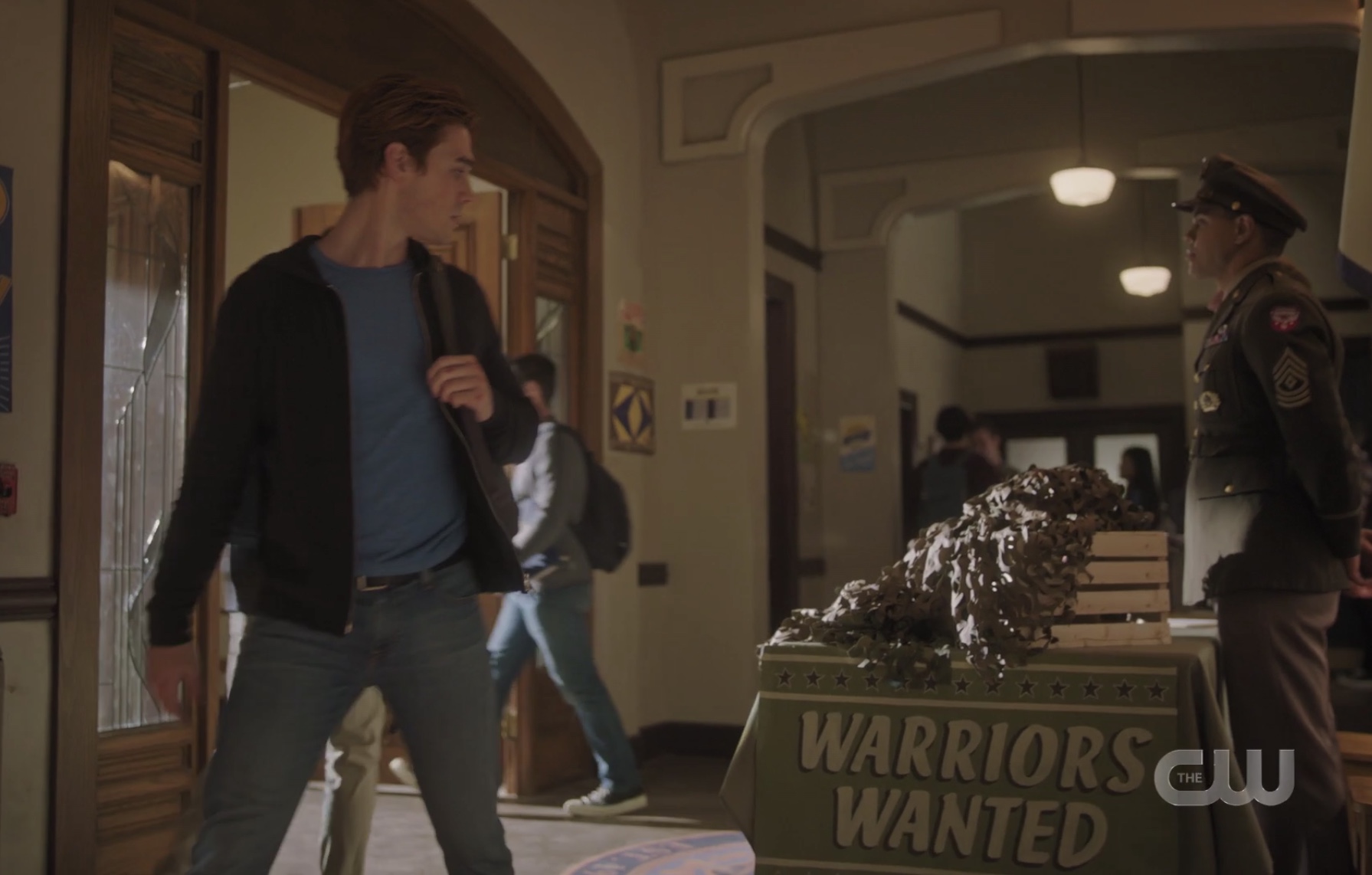 Archie breaking his neck looking back at the army recruitment table in Riverdale High