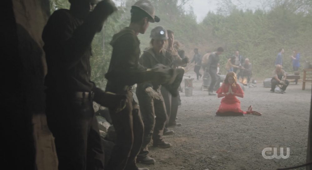 Cheryl prays for salvation at the mouth of her mine