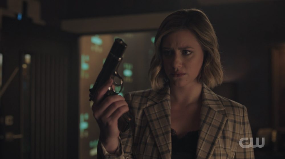 Betty Cooper with the Black Hood's gun on Riverdale