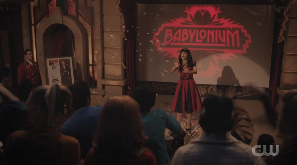 The audience at the Babylonium pelts Veronica Lodge (Camila Mendes) with popcorn when the movie won't start.