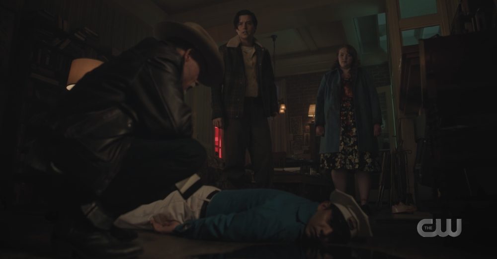 Cheryl and Jughead stand over the dead body of the Milkman on Riverdale