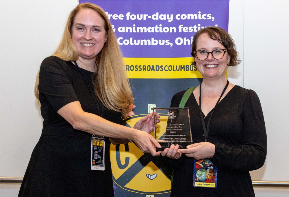Jenny Robb, Curator and Associate Professor at The Billy Ireland Cartoon Library & Museum and Raina Telgemeier, winner of the Transformative Work Award for Smile