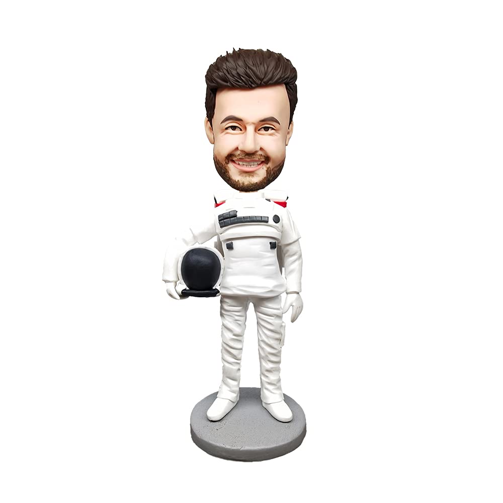 A white man wears a space suit. His head is large.