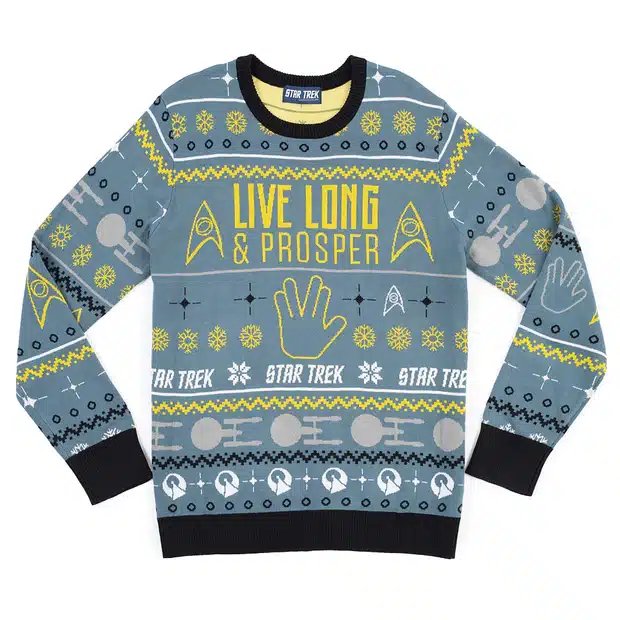 A light blue sweater themed after Spock. Yellow letters read 'Live Long and Prosper,' with yellow science officer badges, white Enterprises, white IDIC symbols, black cuffs and borders, yellow snowflakes, yellow rank bands, and a yellow hand showing the LLAP gesture