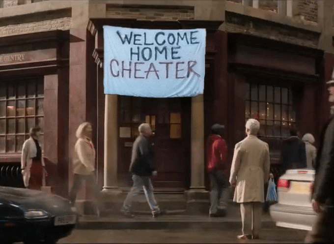 The meme of a white sheet with 'welcome home cheater' written in caps on it, hung from the front of Aziraphale's bookstore. Source unknown.