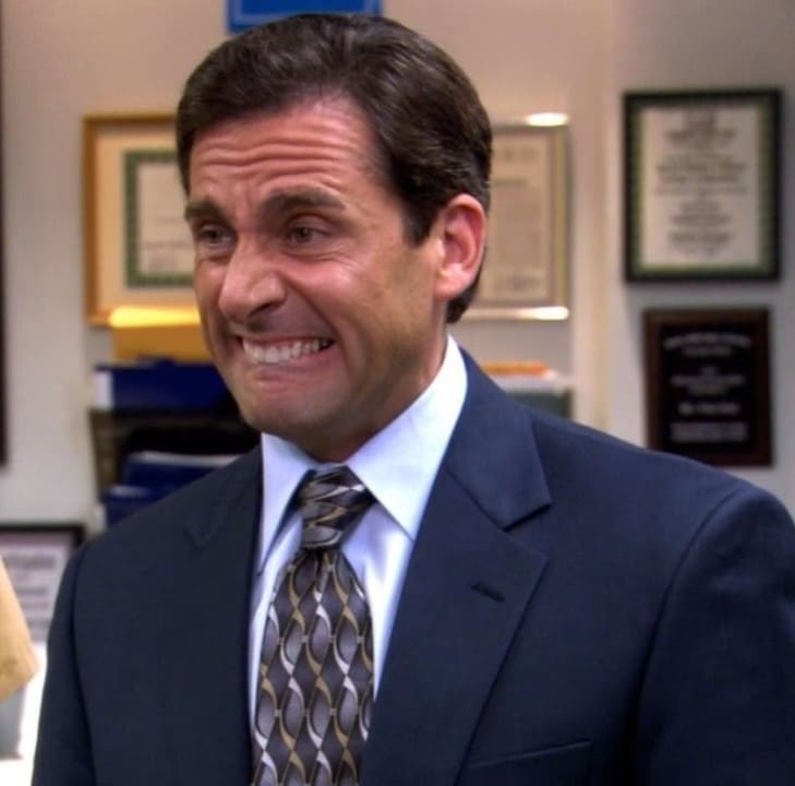 Michael Scott from The Office looking both concerned and embarrassed. 