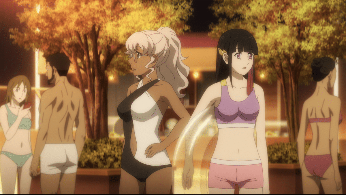 A woman with blonde hair in a black-and-white swimsuit stands next a dark haired woman in a bikini