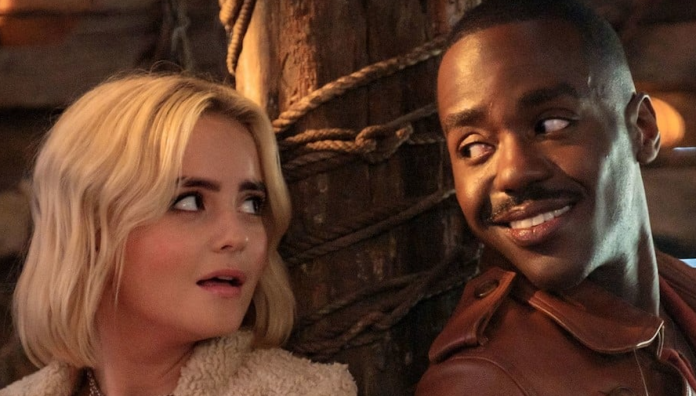 DW Xmas Ruby and the Doctor look at each other in the Doctor Who Xmas special, "The Church on Ruby Road."