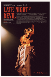 Poster for Late Night with the Devil. It features talk show Jack Delroy with his head replaced by a column of fire.