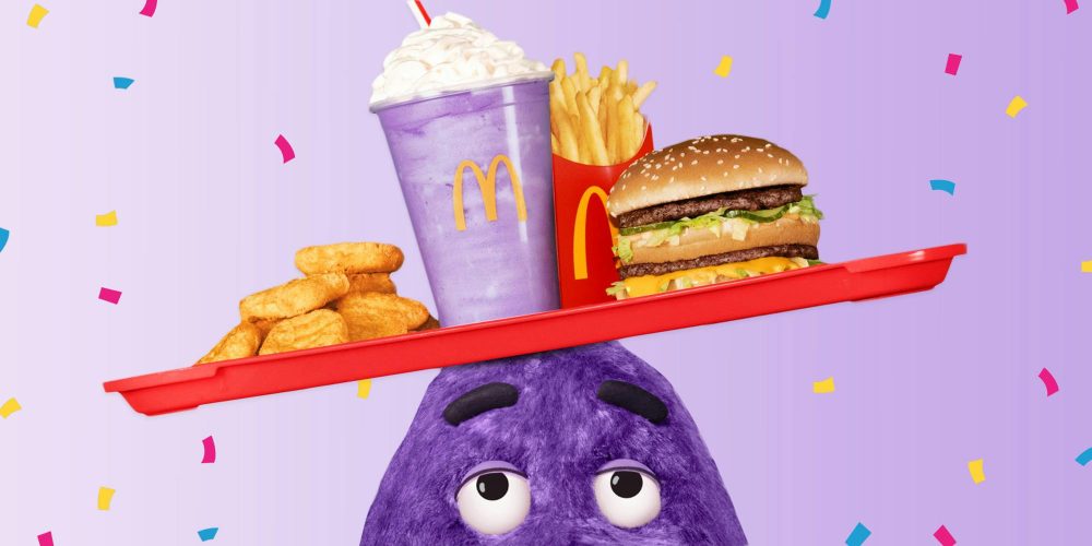 Grimace balances a tray on his head