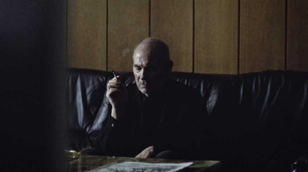 A man smokes a cigarette.