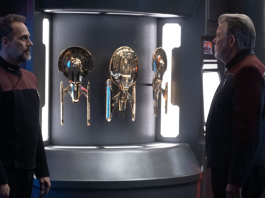 Shaw and Riker and some models of ships aboard the Titan-A.