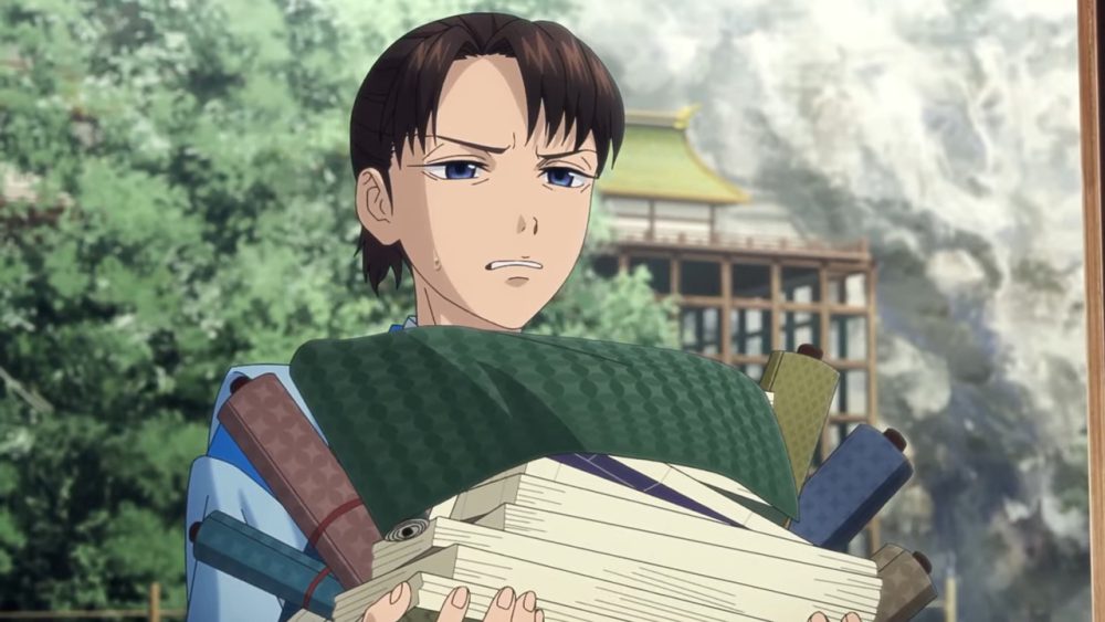 yukiya holds pile of papers