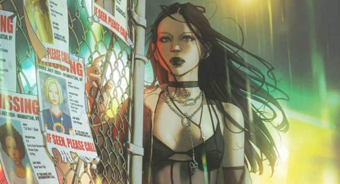 image002 X-23 in fishnet stockings and a cutoff top and bra as she presses against an iron fence, with dark yet colorful yellows, red, and green hues in the backdrop.