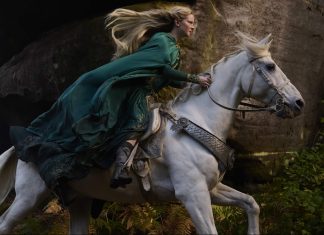 SDCC ’24: RINGS OF POWER Season 2 will bring the rings full circle Morfydd Clark as Galadriel riding on white horse in green dress in The Rings of Power
