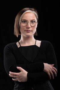 author Rachel Smythe in black with glasses