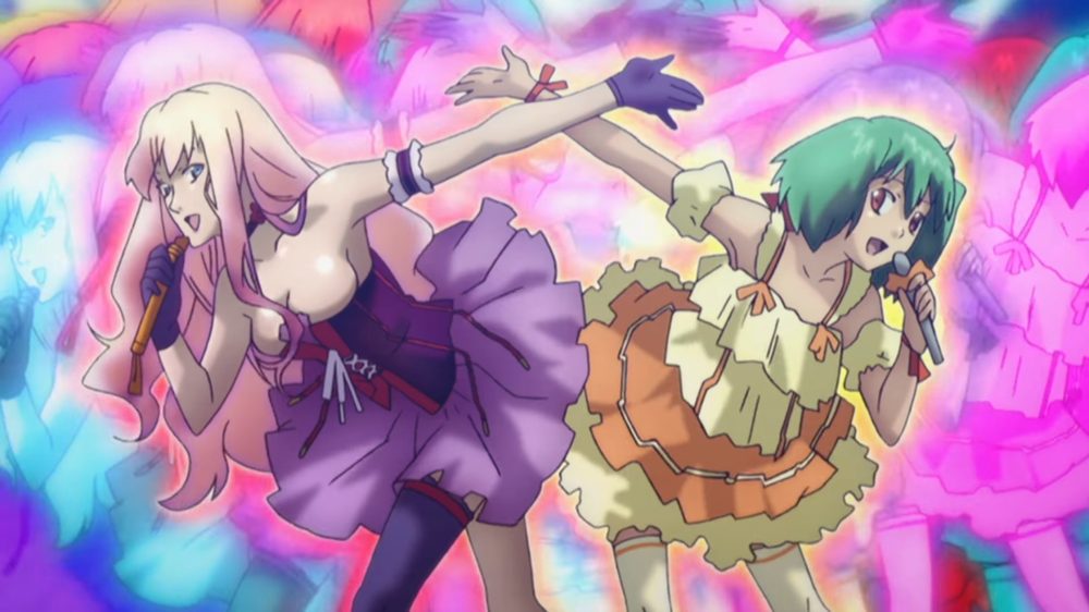macross frontier. two girls pose, one with blonde hair and a purple skirt, the ohter with green hair and an orange and yellow skirt