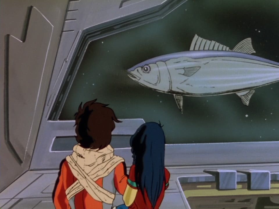 SDF Macross. A young man and woman observe a giant tuna floating through space outside the spaceship hangar.