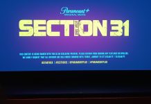 Interview: Comics Beat gathers declassified STAR TREK: SECTION 31 intel A movie screen that displays the logo for Section 31 with a row of theater seats in the foreground.