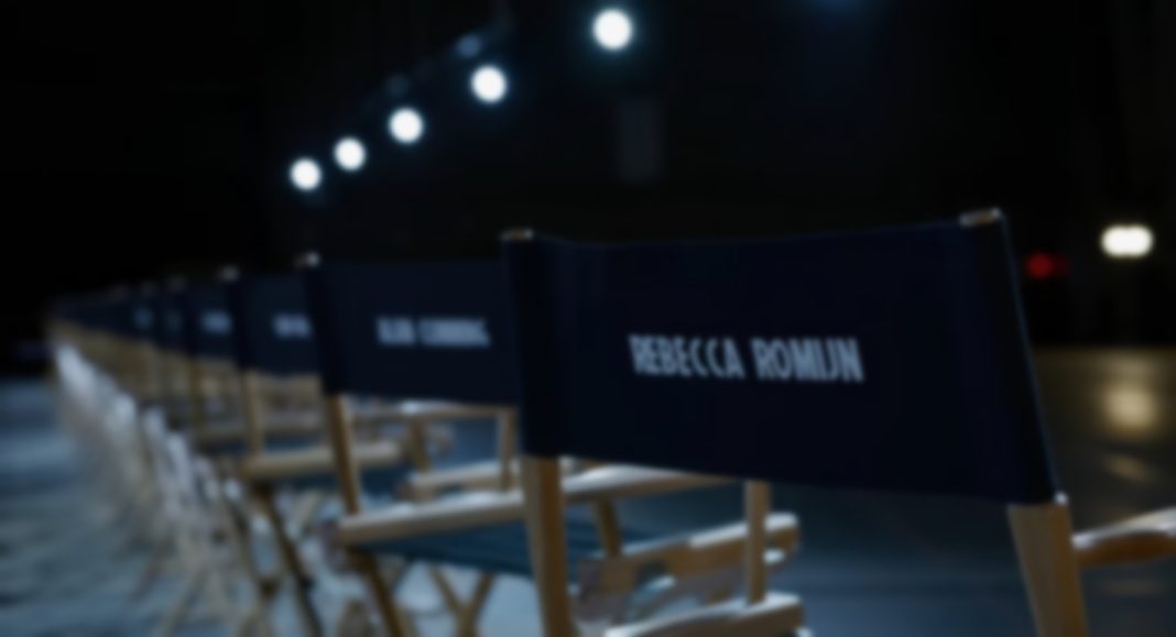 Casting seats in a dimly lit room wih the names of various actors from AVENGERS: DOOMSDAY labelled on the back.