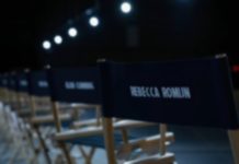 AVENGERS: DOOMSDAY casting announcements are finally here! Casting seats in a dimly lit room wih the names of various actors from AVENGERS: DOOMSDAY labelled on the back.