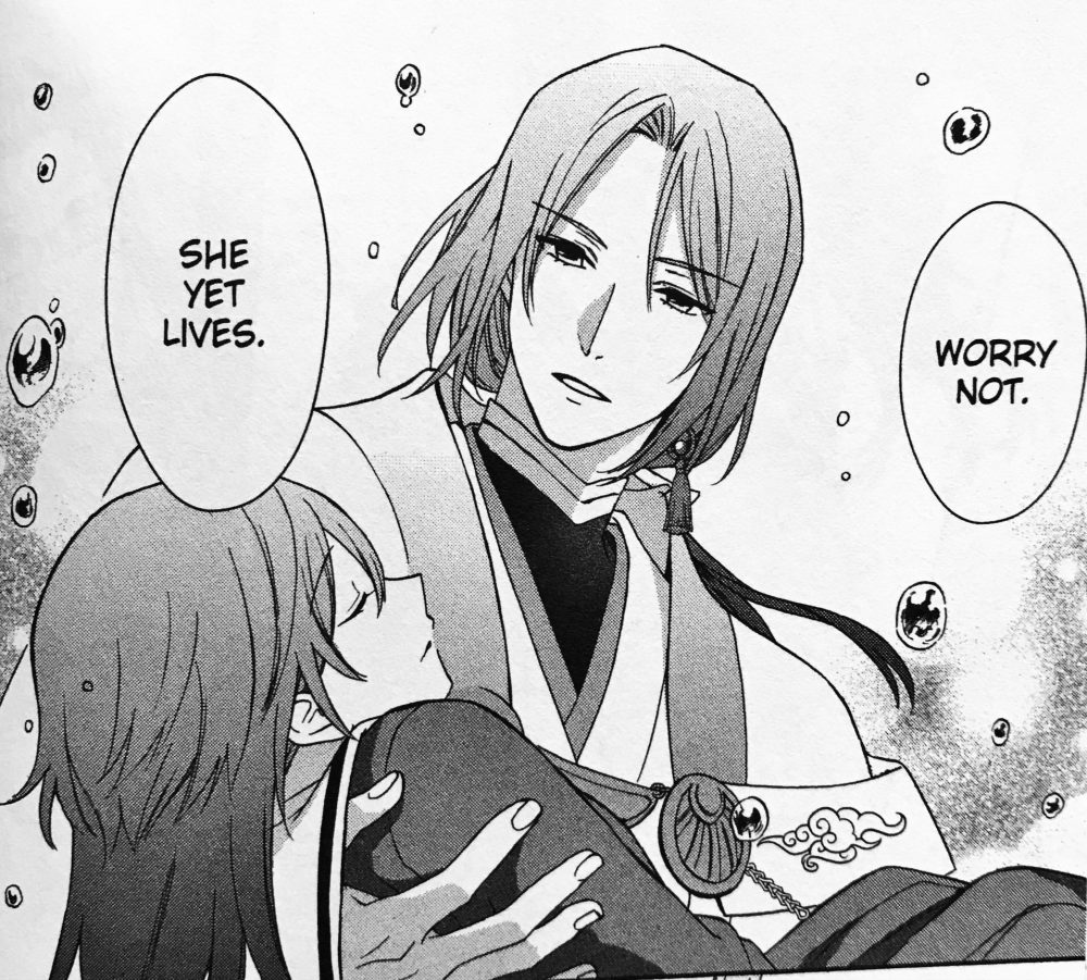 the failure at god school tsukuyomi holding nagi shojo manga out from yen press