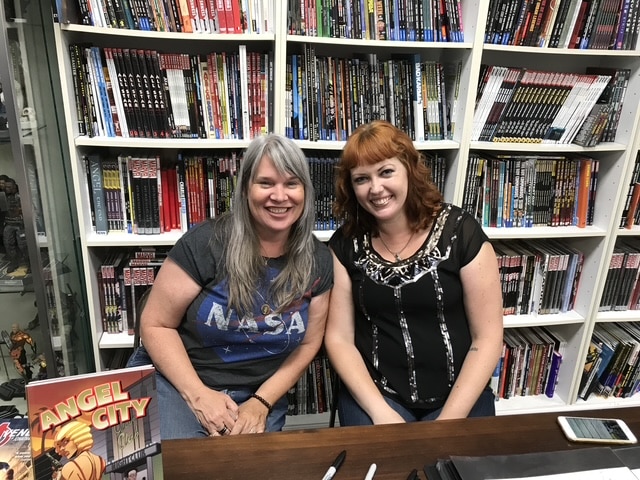Janet Harvey and Megan Levens at an Angel City signing