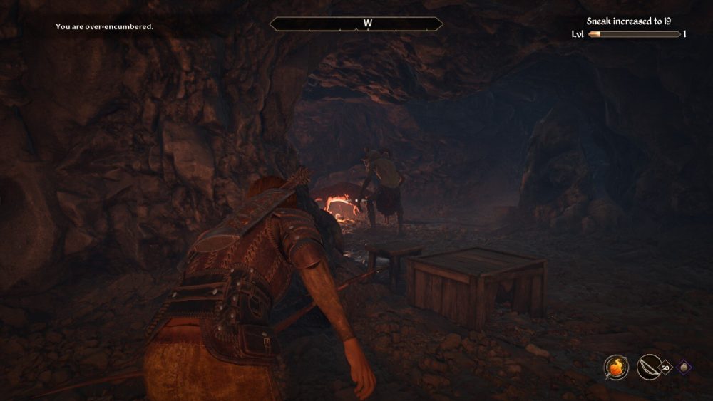 a wood elf archer sneaks behind a goblin roating a large rat in a dimly lit cave in The Elder Scrolls IV: Oblivion remaster.
