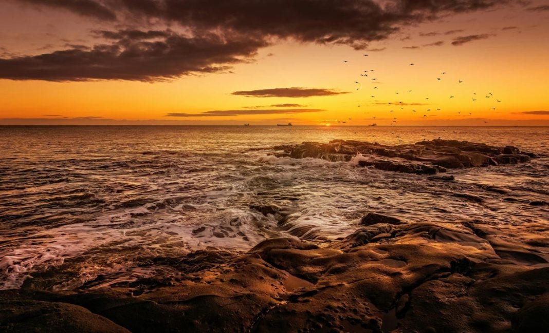 Photo by Ray Bilcliff: https://www.pexels.com/photo/scenic-view-of-a-beach-at-sunset-23914469/
