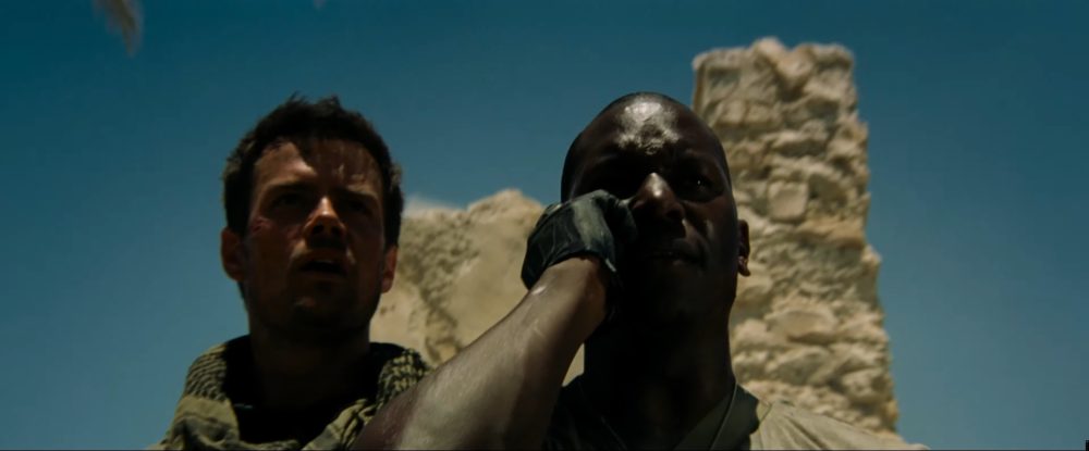 Frame from Micheal Bay's transformers as Captain Lennox played by Josh Duhamel (Left) stands next to Sergeant Epps played by Tyrese Gibson (right) as they call in an AC-130 gunship. Micheal Bay is going to be the director of Skibidi Toilet.