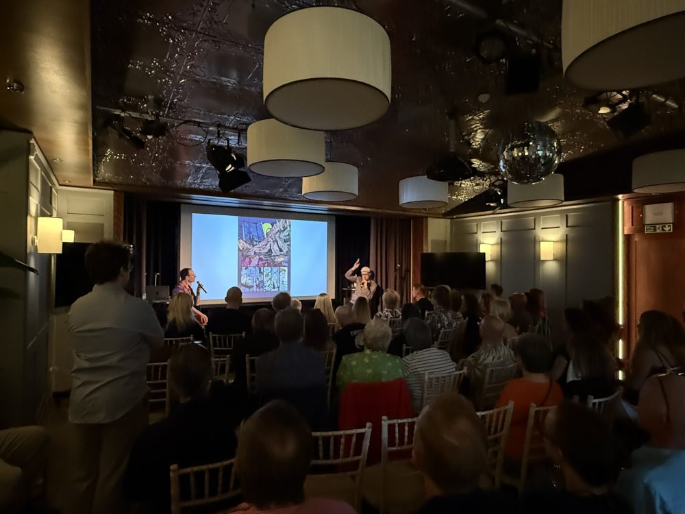 Packed room at the Reinhard Kleist Bowie event