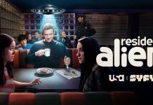 Interview: We abduct the cast and crew of RESIDENT ALIEN season 4 RESIDENT ALIEN -- Pictured: "Resident Alien" Key Art -- (Photo by: SYFY). The cast poses in a diner. A UFO appears above Harry's head.