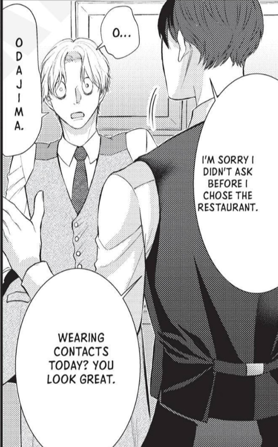 A manga panel depicting two men in suits talking to each other