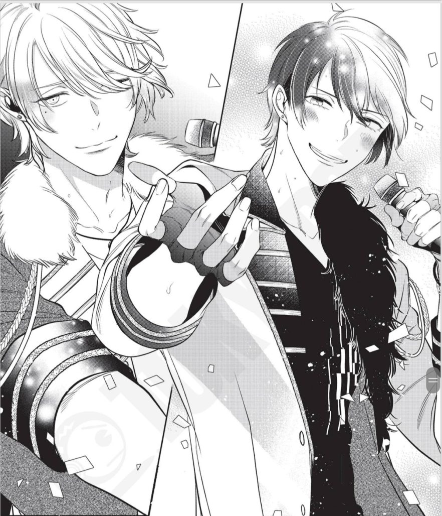Two male idols performing onstage