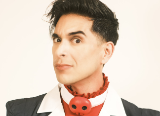 Interview: Brandon Rogers on HELLUVA BOSS and HAZBIN HOTEL Brandon Rogers in Blitzo's outfit from Helluva Boss