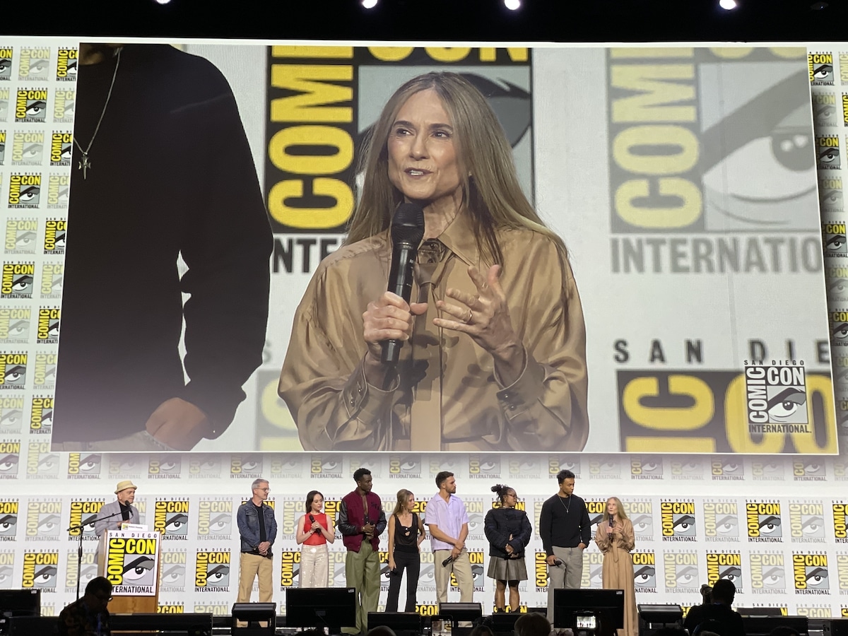 The cast and crew of Starfleet Academy onstage in Hall H during the SDCC '25 Star Trek Universe panel, with Holly Hunter on the big screen behind them.