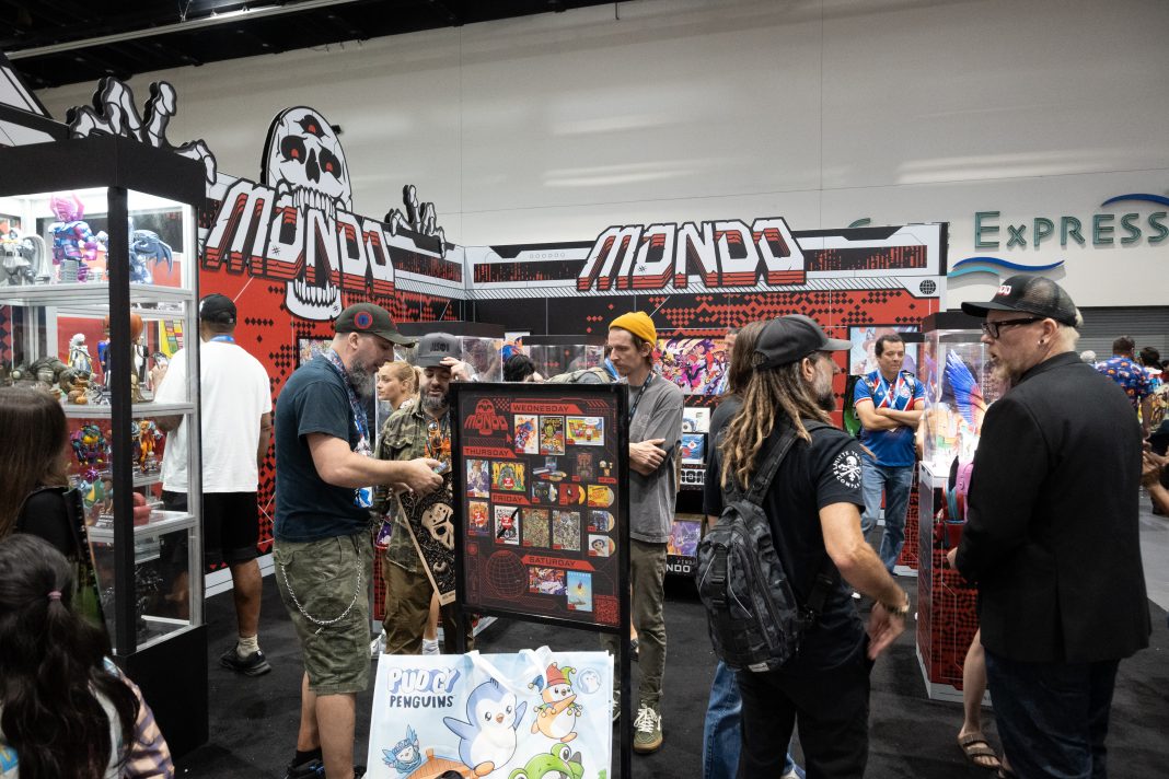 The Mondo booth on the SDCC convention floor full of convention goers.