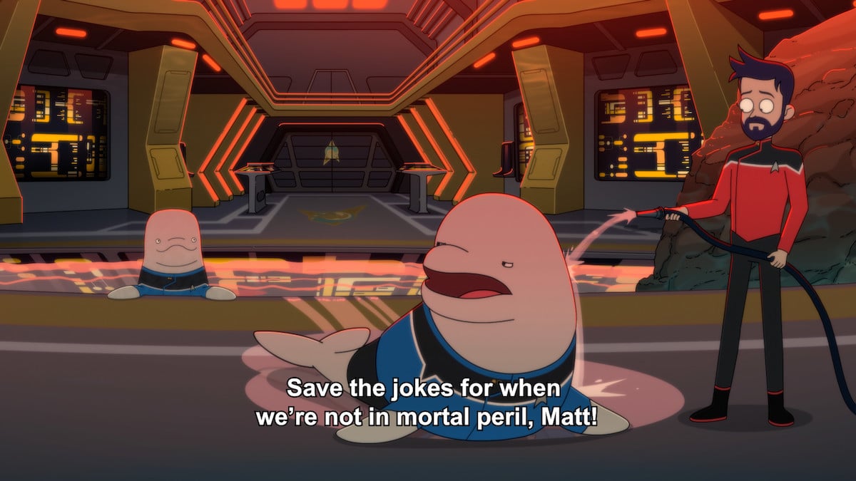 Boimer hoses off Kimolu while Matt watches in Cerritos Cetacean Ops. From Star Trek: Lower Decks.