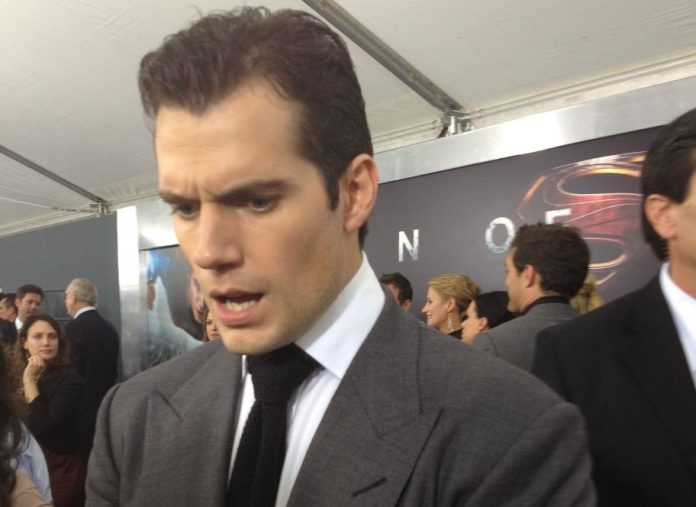 henry cavill at the man of steel premiere Henry Cavill in a suit, looking concerned, at the MAN OF STEEL premiere.