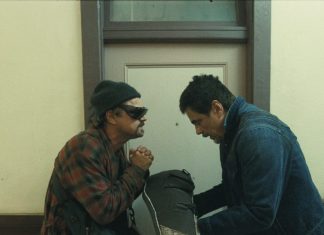 Movie Review: ONE BATTLE AFTER ANOTHER is an epic connecting to our troubled times (L-r) LEONARDO DI CAPRIO as Bob Ferguson and BENICIO DEL TORO as Sensei St. Carlos in “One Battle After Another.” A Warner Bros. Pictures Release.